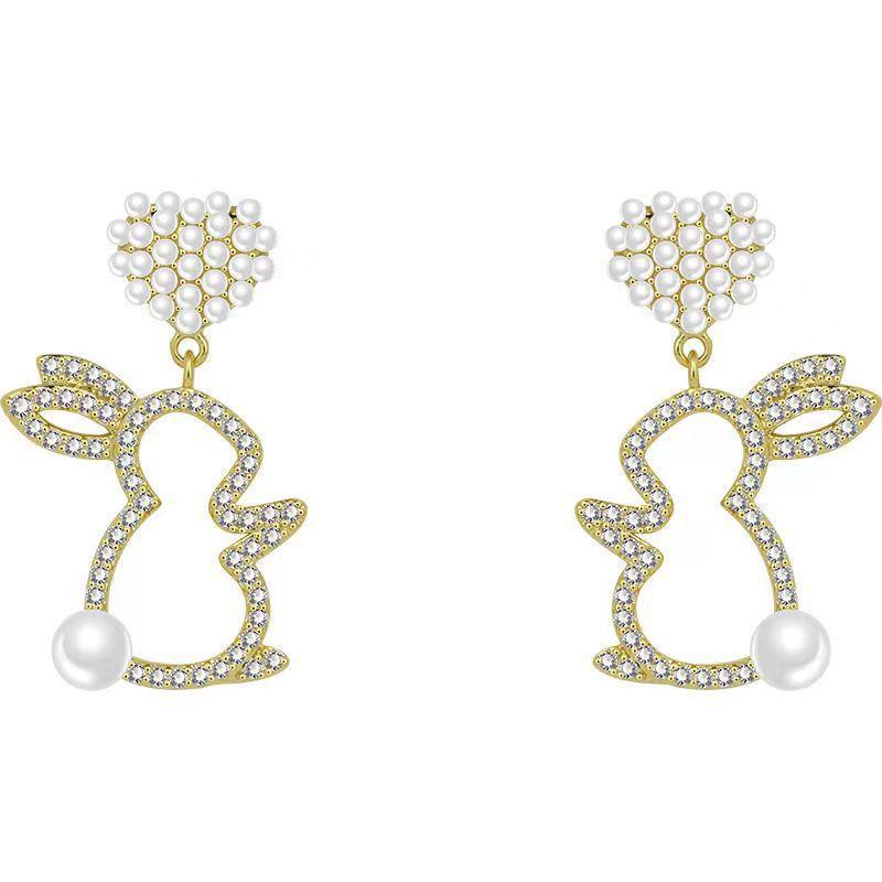 Adorn your ears with our Pearl Bunny Earrings, featuring a silver pin for a charming and stylish addition to your jewelry collection.