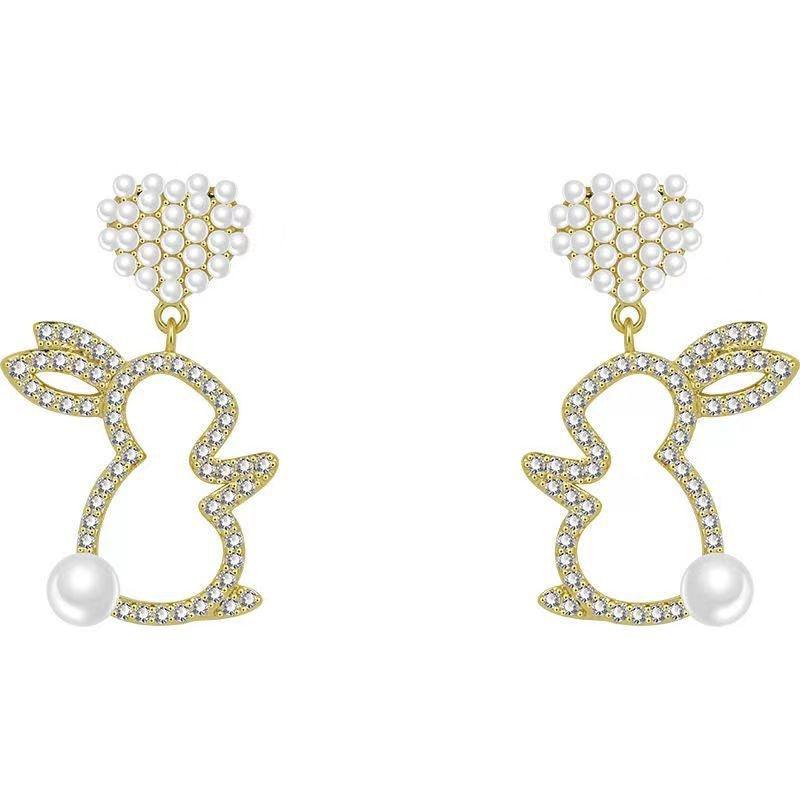Adorn your ears with our Pearl Bunny Earrings, featuring a silver pin for a charming and stylish addition to your jewelry collection.