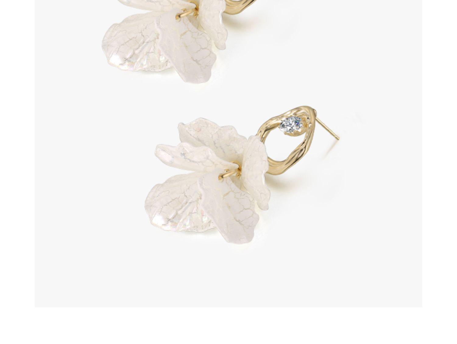 Elevate your style with our Women's Foreign Style White Petal Earrings, perfectly suited for silver pins.