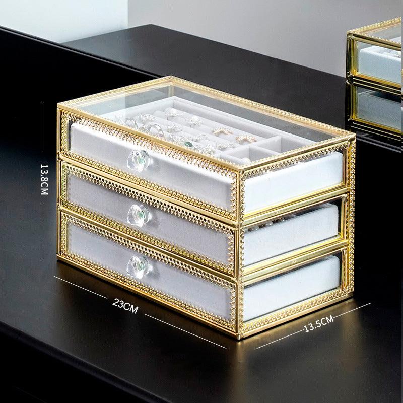 Keep your jewelry in style with our Copper-Edged Glass Jewelry Box, designed to organize earrings, rings, and necklaces with elegance. - Bloomjay