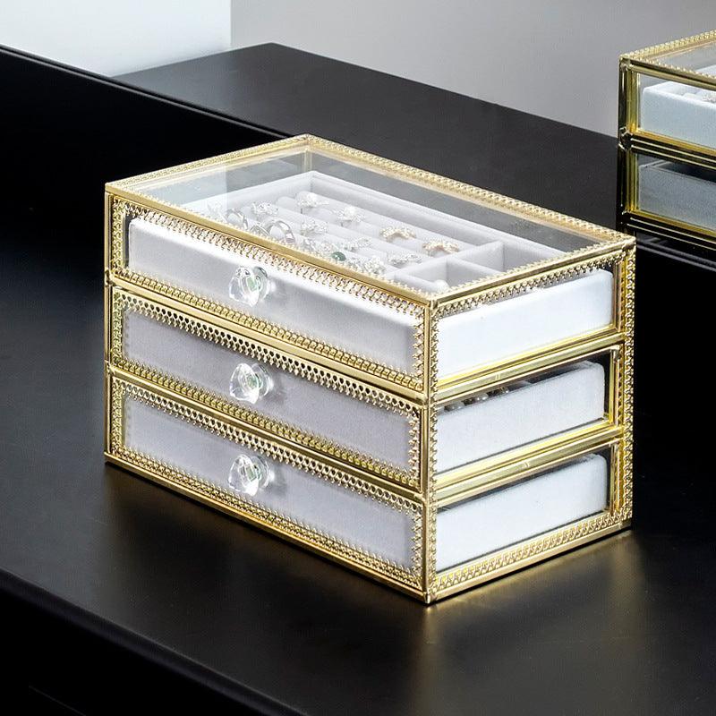 Keep your jewelry in style with our Copper-Edged Glass Jewelry Box, designed to organize earrings, rings, and necklaces with elegance. - Bloomjay