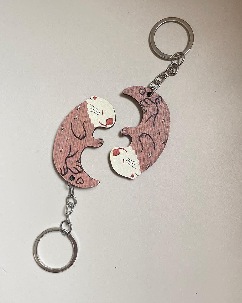 Add a touch of creativity to your accessories with our Simulation Wooden Couple Otter Keychain, a charming and unique accessory.