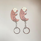 Add a touch of creativity to your accessories with our Simulation Wooden Couple Otter Keychain, a charming and unique accessory.