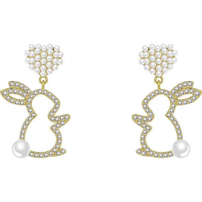 Adorn your ears with our Pearl Bunny Earrings, featuring a silver pin for a charming and stylish addition to your jewelry collection.