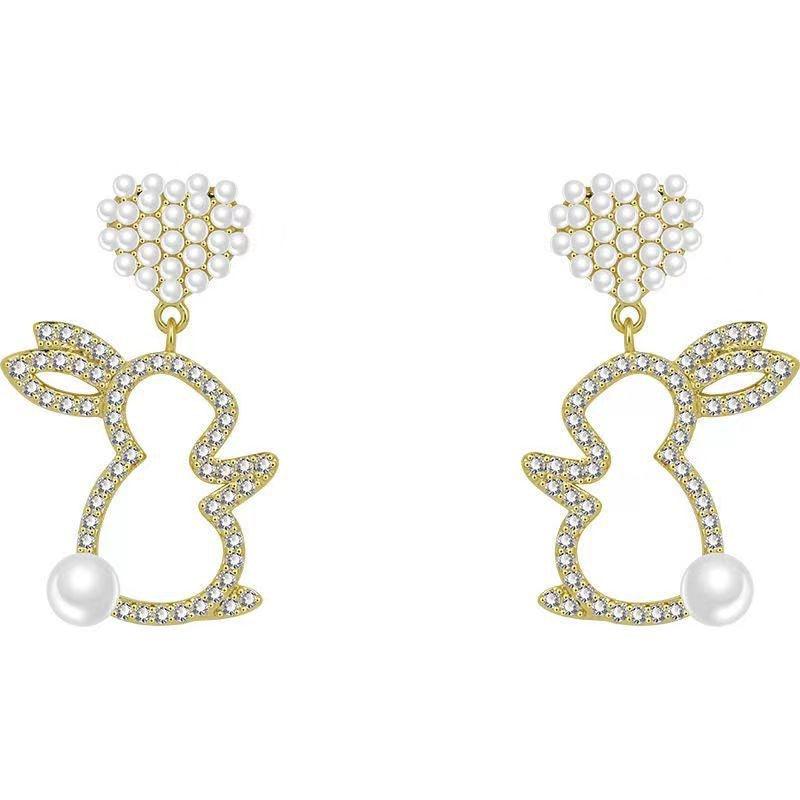 Adorn your ears with our Pearl Bunny Earrings, featuring a silver pin for a charming and stylish addition to your jewelry collection.