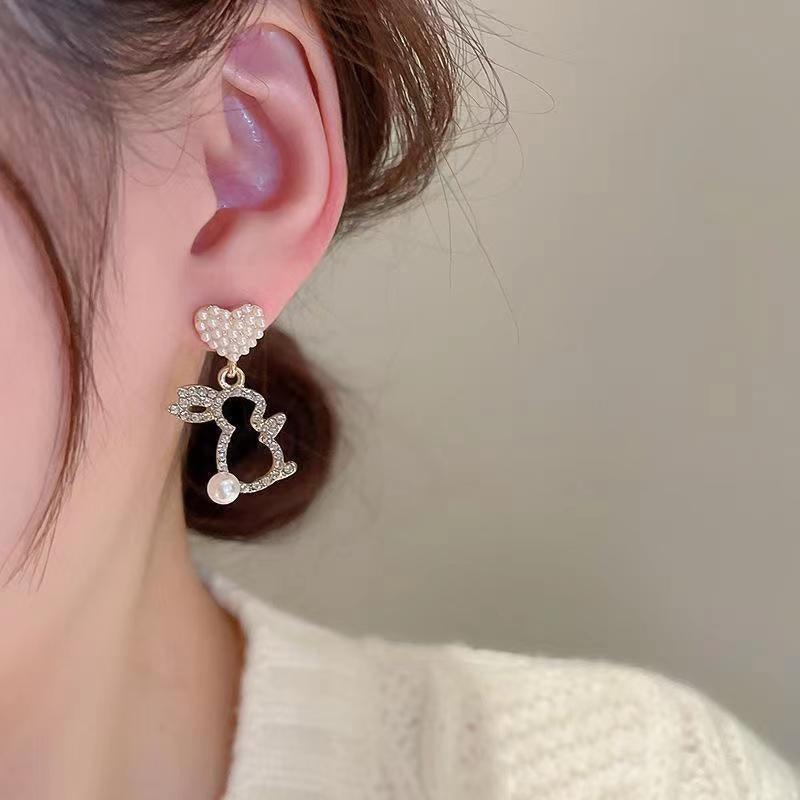 Adorn your ears with our Pearl Bunny Earrings, featuring a silver pin for a charming and stylish addition to your jewelry collection.