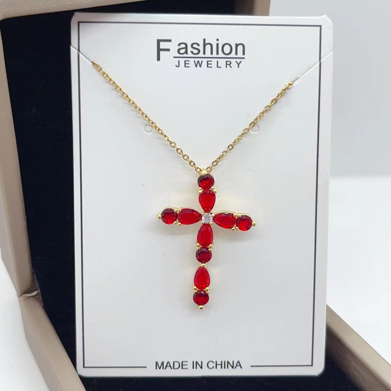 Adorn yourself with our Fashion Jewelry Micro Inlay Colorful Zircon Water Drops Cross Necklace for a vibrant and stylish accessory.