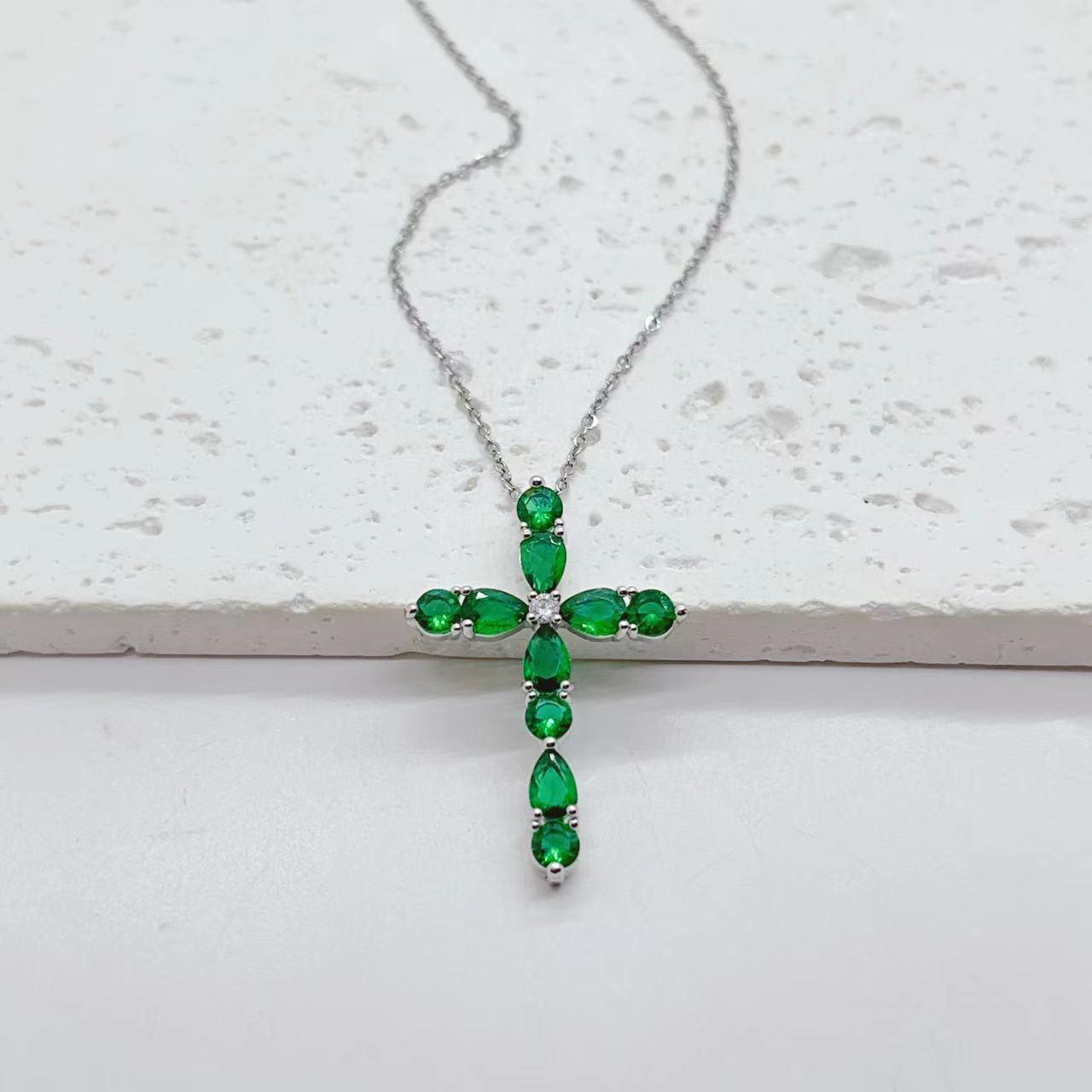 Adorn yourself with our Fashion Jewelry Micro Inlay Colorful Zircon Water Drops Cross Necklace for a vibrant and stylish accessory.