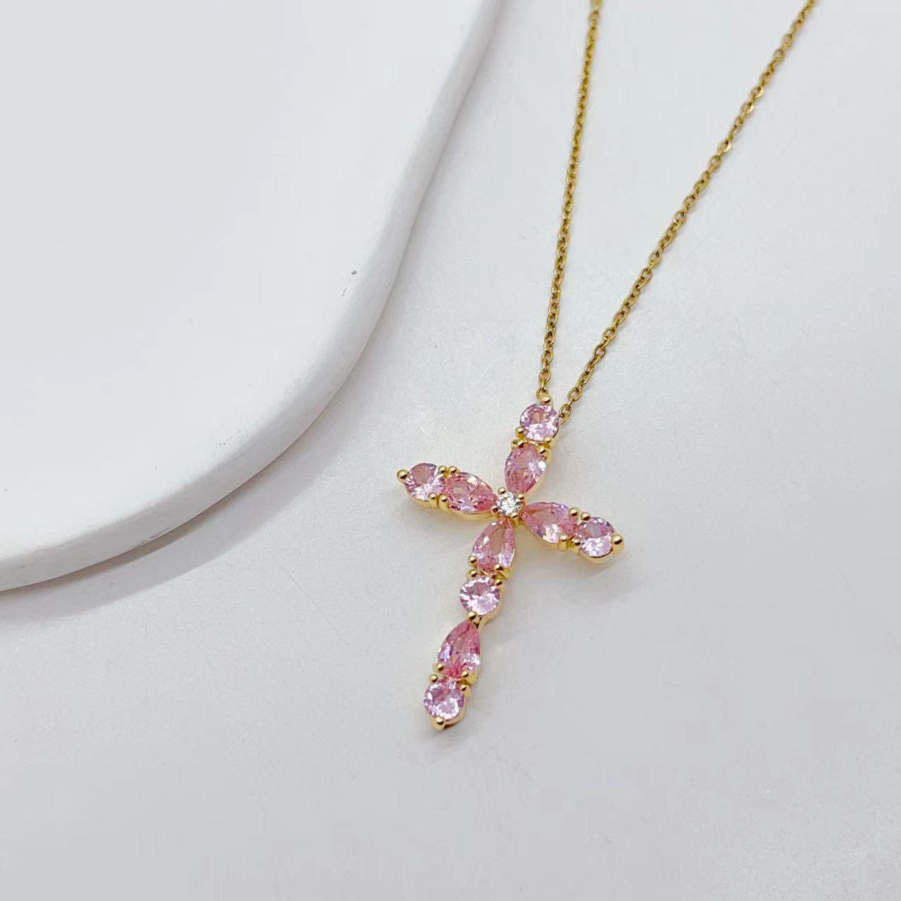 Adorn yourself with our Fashion Jewelry Micro Inlay Colorful Zircon Water Drops Cross Necklace for a vibrant and stylish accessory.