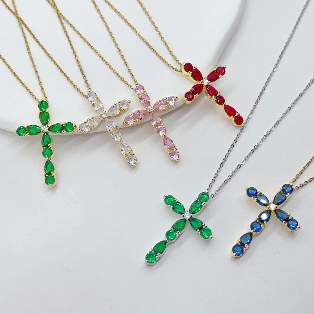 Adorn yourself with our Fashion Jewelry Micro Inlay Colorful Zircon Water Drops Cross Necklace for a vibrant and stylish accessory.
