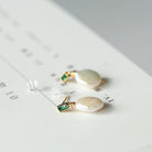 Adorn yourself with the natural beauty of Freshwater Baroque Pearl Earrings, a timeless and elegant accessory.