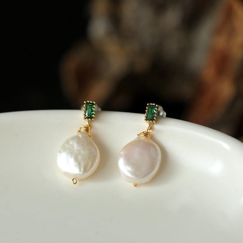 Adorn yourself with the natural beauty of Freshwater Baroque Pearl Earrings, a timeless and elegant accessory.