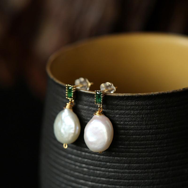 Adorn yourself with the natural beauty of Freshwater Baroque Pearl Earrings, a timeless and elegant accessory.