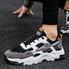 "Black White Lace-up Sneakers: Outdoor Breathable Mesh Shoes, Lightweight Running Sports Shoes for Men."