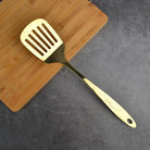 "Copper Kitchen Utensil Set: Spoon, Spatula, Colander, Frying Spatula."