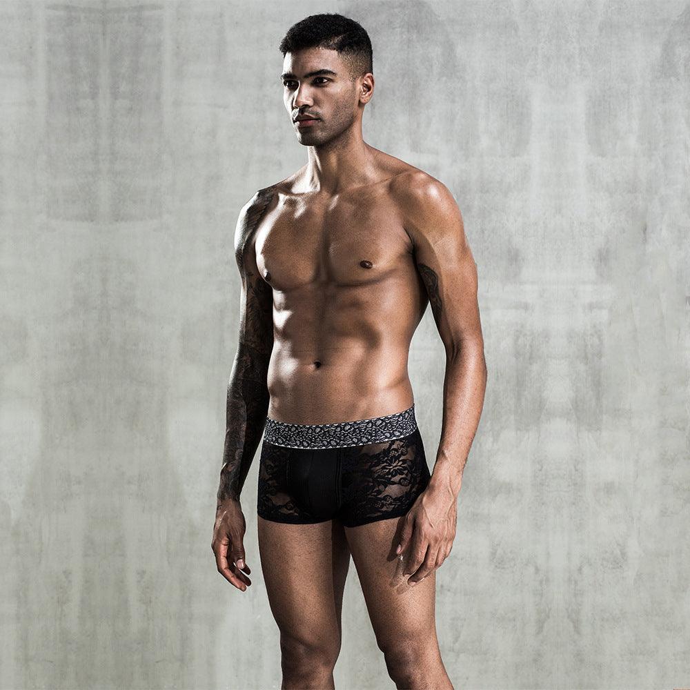 Discover the perfect combination of allure and style with our Black Lace See-through Men's Boxers.