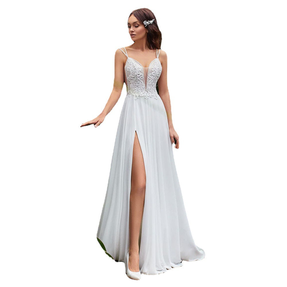 Eightree presents a stunning A-Line Wedding Dress with a sexy side slit, Boho beading, spaghetti straps, lace appliques, and a backless design in chiffon.