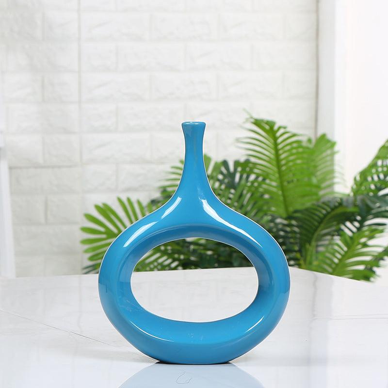 Elevate your home décor with our intricate hollow ceramic vase