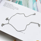 Elevate your style with our Fashion Jewelry Fine Asymmetric Star and Moon Bracelet for women.