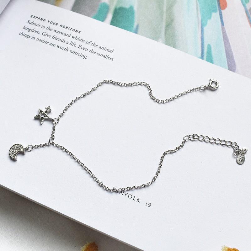 Elevate your style with our Fashion Jewelry Fine Asymmetric Star and Moon Bracelet for women.