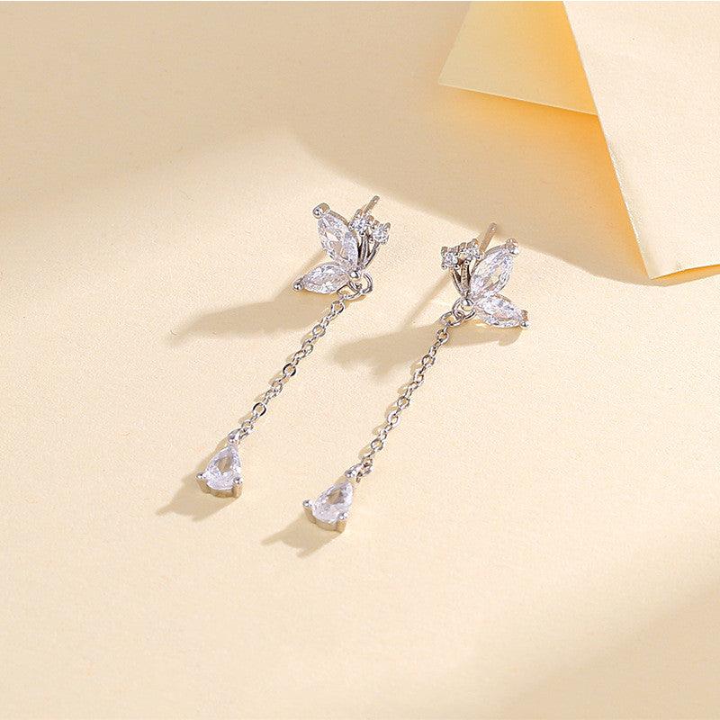 Elevate your style with our S925 Butterfly Zircon Tassel Earrings – a blend of elegance and sophistication for the modern woman.