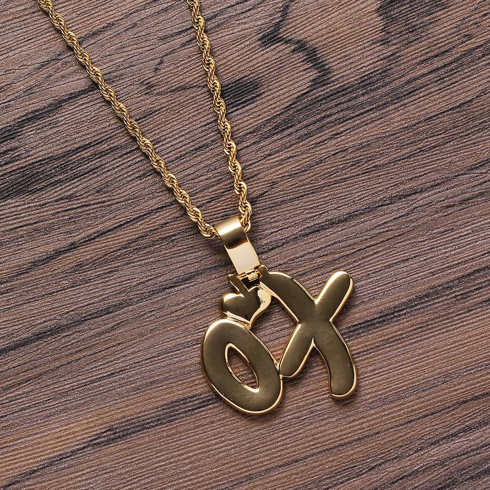 Enhance your style with our Copper XO Pendant Necklace, featuring intricate zircon inlay for a touch of elegance and charm.