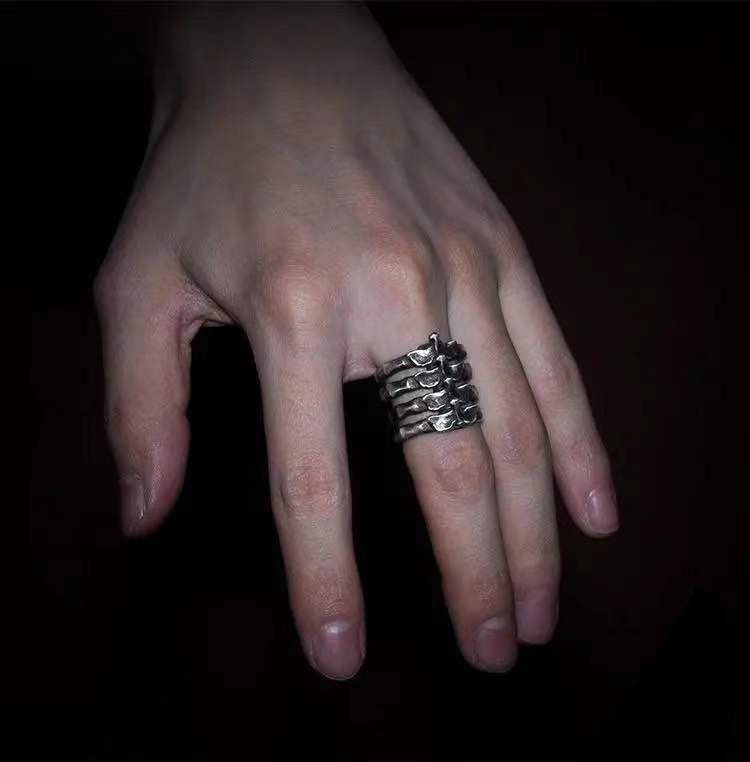 Explore creativity in fashion with our Rib Alloy Bone Ring for men, a unique and stylish jewelry piece.