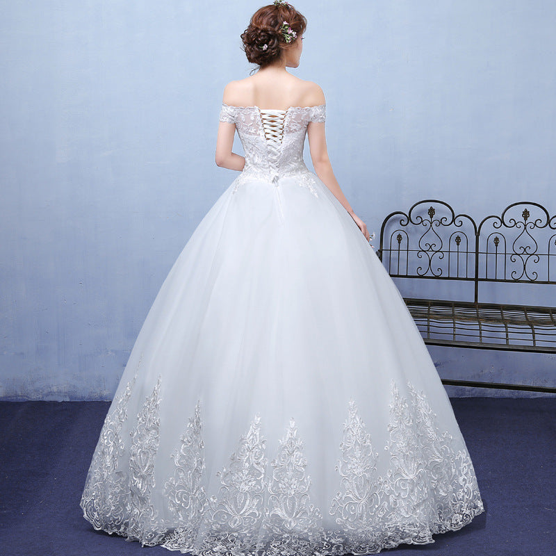 In the summer, envision a bride adorned in a bespoke lace wedding dress, accentuating her shoulders with elegance.