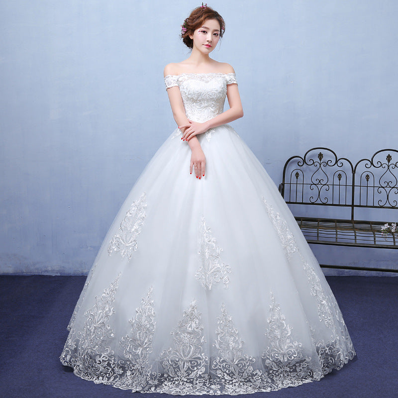 In the summer, envision a bride adorned in a bespoke lace wedding dress, accentuating her shoulders with elegance.