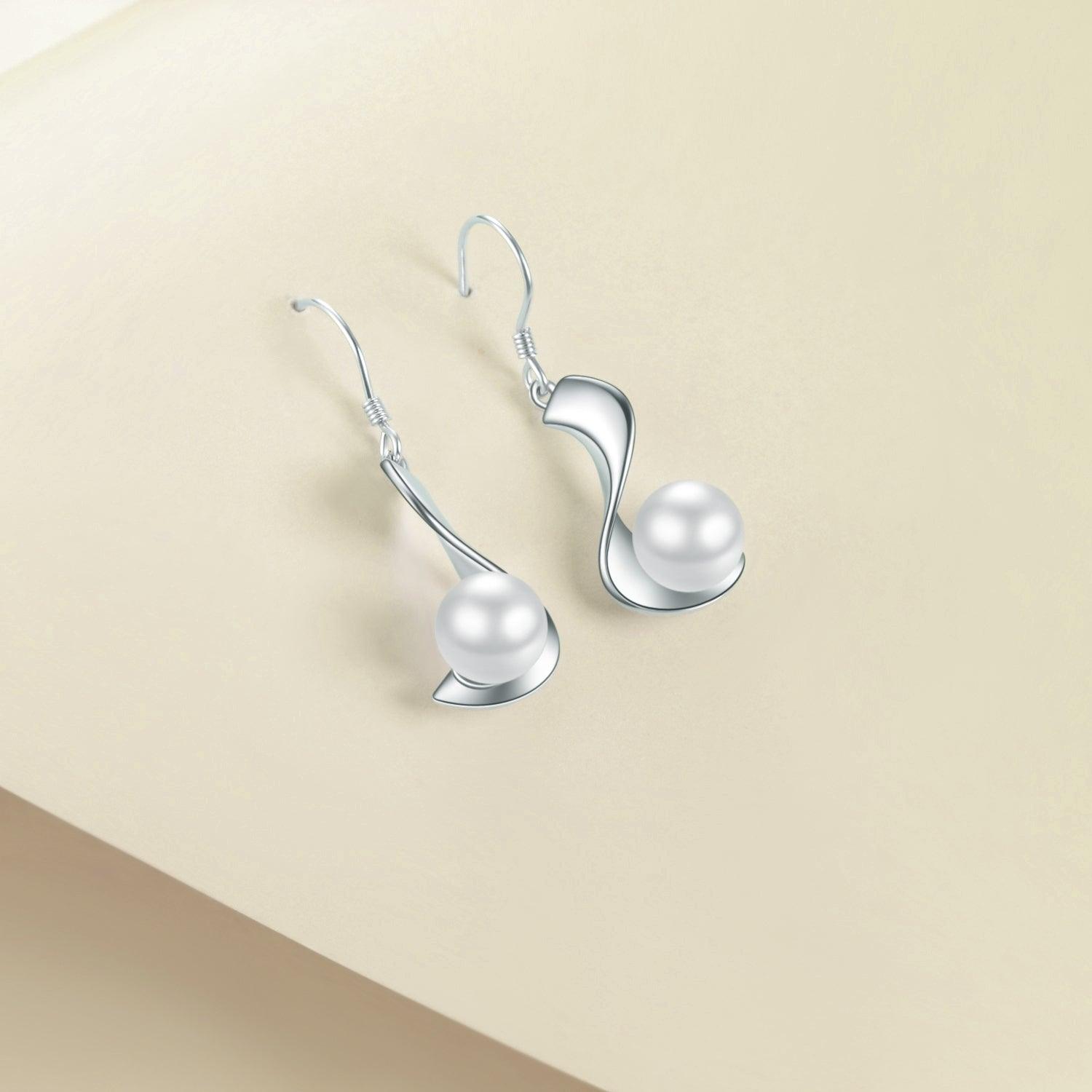 Indulge in sophistication with Sterling Silver 8mm Pearl Drop Earrings, a fine jewelry accent for women.