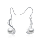 Indulge in sophistication with Sterling Silver 8mm Pearl Drop Earrings, a fine jewelry accent for women.