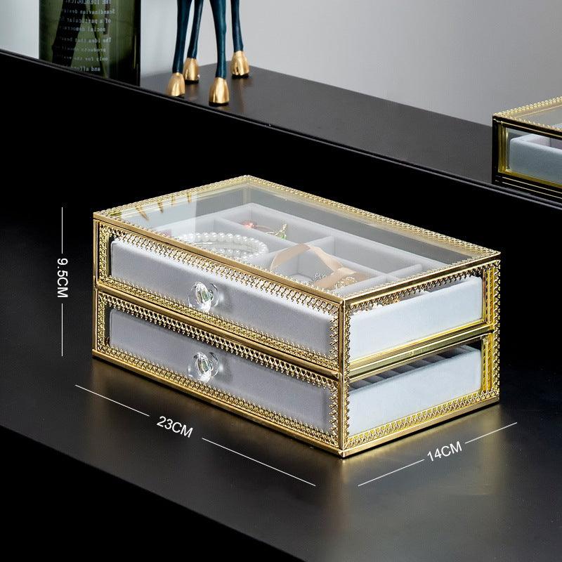 Keep your jewelry in style with our Copper-Edged Glass Jewelry Box, designed to organize earrings, rings, and necklaces with elegance.