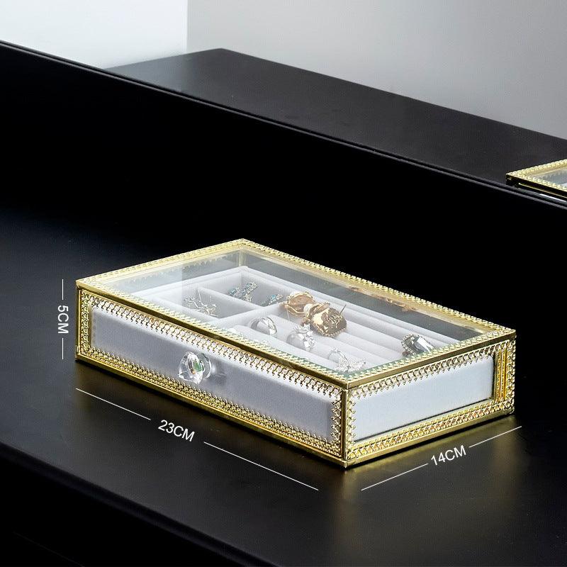 Keep your jewelry in style with our Copper-Edged Glass Jewelry Box, designed to organize earrings, rings, and necklaces with elegance.