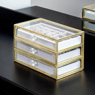 Keep your jewelry in style with our Copper-Edged Glass Jewelry Box, designed to organize earrings, rings, and necklaces with elegance.