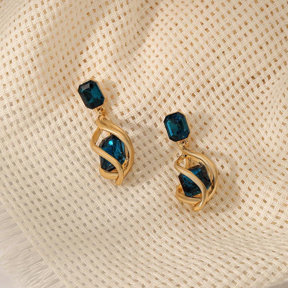 Revive your style with our Retro Emerald Stud Earrings for a touch of creative and fashionable flair.