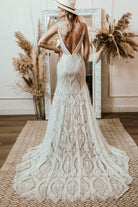 Roycebridal presents a Bohemian Wedding Dress with a V-neck, Lace Boho details, Spaghetti Straps, and a Backless design, perfect for a Beach Bridal Gown.