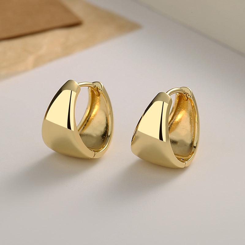 Upgrade your elegance with these U-shaped sterling silver earrings, plated in luxurious 18k gold.