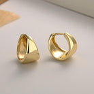 Upgrade your elegance with these U-shaped sterling silver earrings, plated in luxurious 18k gold.