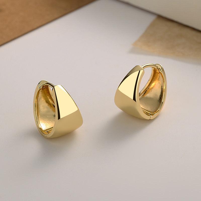 Upgrade your elegance with these U-shaped sterling silver earrings, plated in luxurious 18k gold.