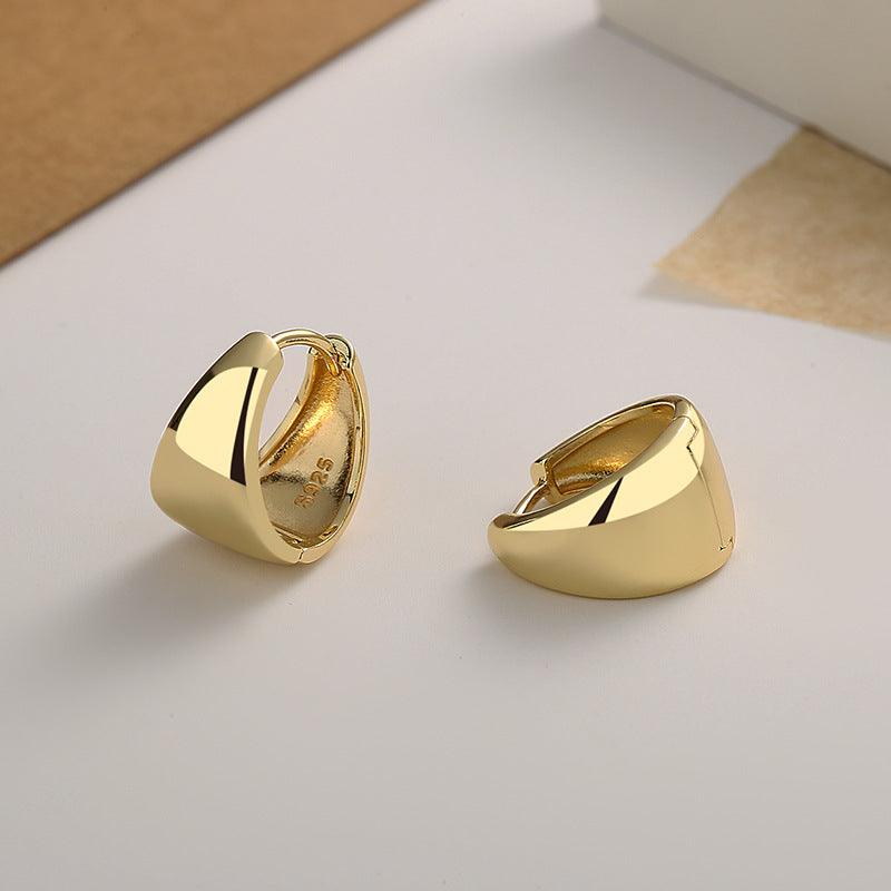 Upgrade your elegance with these U-shaped sterling silver earrings, plated in luxurious 18k gold.