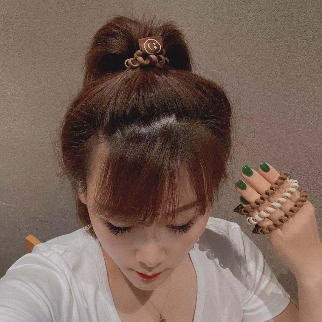 Achieve a cute look with our Milk Tea Frosted Hair Circle, featuring a smiley face rope for girls' hair. - Bloomjay