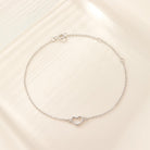 Adorn your wrist with sophistication using these heart-shaped bracelets crafted from sterling silver and plated in 18k gold or white gold. - Bloomjay