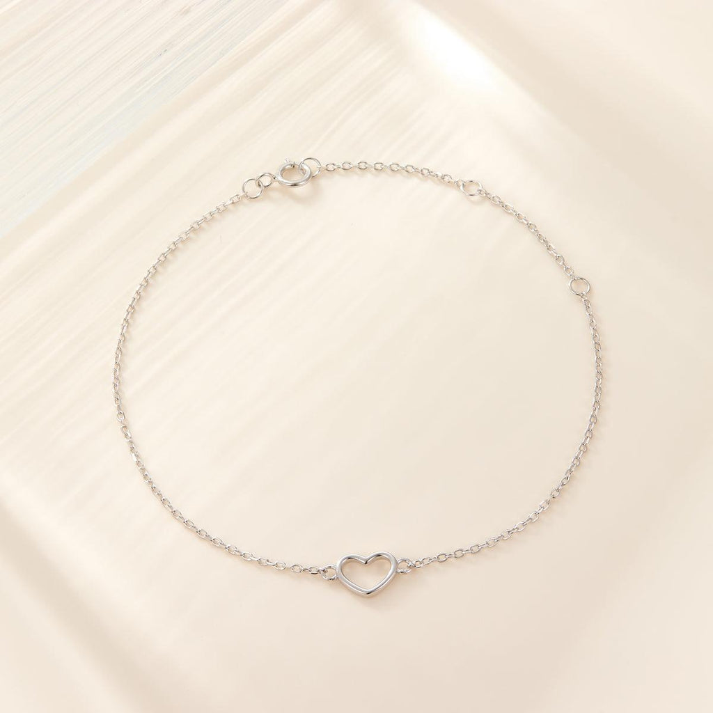 Adorn your wrist with sophistication using these heart-shaped bracelets crafted from sterling silver and plated in 18k gold or white gold. - Bloomjay